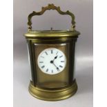 French oval brass-cased chiming carriage clock, white enamel dial with Roman numeral hour markers,