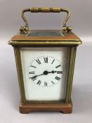 French carriage clock with a brass case, white dial with Roman numerals, marked 'France' to case