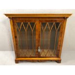 Reproduction glazed two door display cabinet with column detailing and fitted with internal