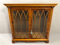 Reproduction glazed two door display cabinet with column detailing and fitted with internal