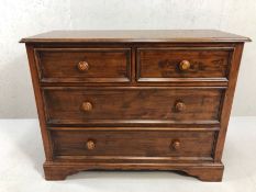 Modern dark wood chest of four drawers approx 110cm x 46cm x 86cm tall