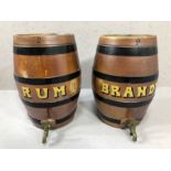A pair of stoneware barrels each with brass pouring spout, labelled Rum and Brandy, each approx 33cm
