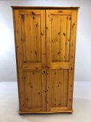 Pine two door wardrobe with internal mirror and hanging rail, approx 103cm x 61cm x 187cm tall