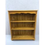 Pine bookshelf on bun feet, approx 83cm x 29cm x 100cm tall