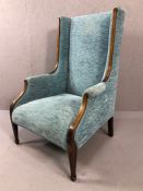 Edwardian fire side armchair with tapering front legs and inlay, upholstered in teal chenille