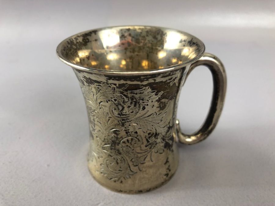 Hallmarked Silver cup with all over floral design dated 1908 and by maker Joseph Gloster Ltd, 7cm