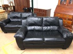 Pair of black faux leather modern two seater sofas, each approx 106cm in length