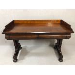 Large Victorian mahogany desk on twin legs with arched stretcher, bun feet with castors, two drawers