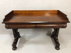 Large Victorian mahogany desk on twin legs with arched stretcher, bun feet with castors, two drawers
