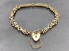 9ct Gold fancy link bracelet with 9ct Gold heart shaped lock and safety chain approx 18cm long and