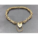 9ct Gold fancy link bracelet with 9ct Gold heart shaped lock and safety chain approx 18cm long and