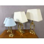 Collection of four modern styled table lamps in gold