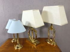 Collection of four modern styled table lamps in gold