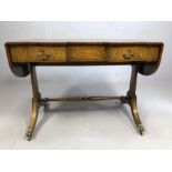 Fine quality reproduction regency writing desk with two drawers, turned stretcher, on splayed