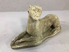 Ornamental stone garden ornament in the form of a dog, approx 58cm x 31cm