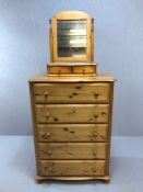 Pine chest of five drawers with bun handles and feet, topped with a two drawer pine dressing table