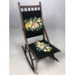 Folding antique rocking chair with tapestry detailing on seat and back