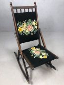 Folding antique rocking chair with tapestry detailing on seat and back