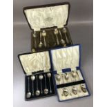 Three cased sets of Hallmarked silver spoons The largest set by Reid & Sons