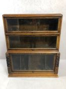 Globe Wernicke style waterfall bookcase with three up and over glass fronted doors, another