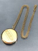 9ct Gold chain (approx 3g) and a 9ct front and back circular hinged gold locket