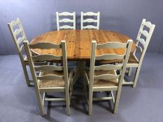 Circular pine extendable dining table (approx 110cm in diameter - unextended) and six rush-seated,