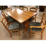 Large pine farmhouse table with pegged central stretcher and eight pine chairs, table approx 183cm x