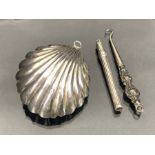 Silver Hallmarked Items to include a Silver babies rattle in the form of a shell and a propelling