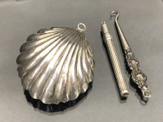 Silver Hallmarked Items to include a Silver babies rattle in the form of a shell and a propelling