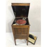 Gramophone by Binns & Co, No 124a, in wooden case on tapering legs, containing a selection of