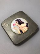 Hallmarked silver square cigarette case with applied over enamel panel of an erotic rose lady