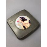 Hallmarked silver square cigarette case with applied over enamel panel of an erotic rose lady