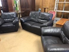 Brown leather three piece suite comprising two seater sofa and two armchairs, sofa approx 156cm in