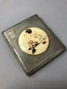 Hallmarked silver square cigarette case with applied over enamel panel of an erotic lady smoking,