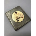 Hallmarked silver square cigarette case with applied over enamel panel of an erotic lady smoking,