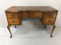 Walnut serpentine fronted desk or dressing table on queen anne legs with scallop detailing