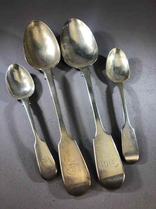 Four Silver hallmarked Victorian Fiddle spoons. Two serving spoons maker possibly A B Savory &