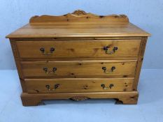 Pine chest of three drawers with metal handles and upstand