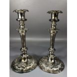 A Fine pair of silver coloured candlesticks on circular bases approx 25cm tall