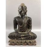 Carved wooden seated deity or Buddha approx 30cm tall