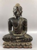 Carved wooden seated deity or Buddha approx 30cm tall