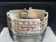 Silver Bracelet of five rectangular hallmarked Silver panels each with raised floral decoration