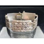 Silver Bracelet of five rectangular hallmarked Silver panels each with raised floral decoration