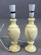 Pair of onxy baulster lamps, approx 34cms tall