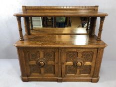 Ornately carved oak buffet with two cupboards below, mirrored back and gallery top, approx 142cm x