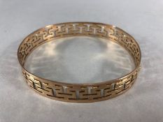 9ct Gold pierced bangle approx 8cm in diameter 12mm wide and 23.6g