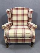 Laura Ashley Southwold raspberry check reclining wingback armchair, on brass front castors