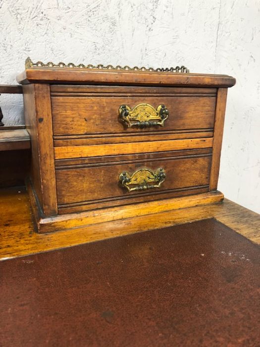 Antique writing desk on turned legs and castors with burgundy leather insert and gallery with - Image 6 of 17