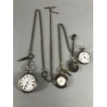 Three silver pocket watches and a silver coloured locket