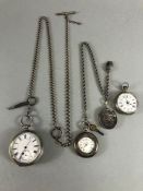 Three silver pocket watches and a silver coloured locket